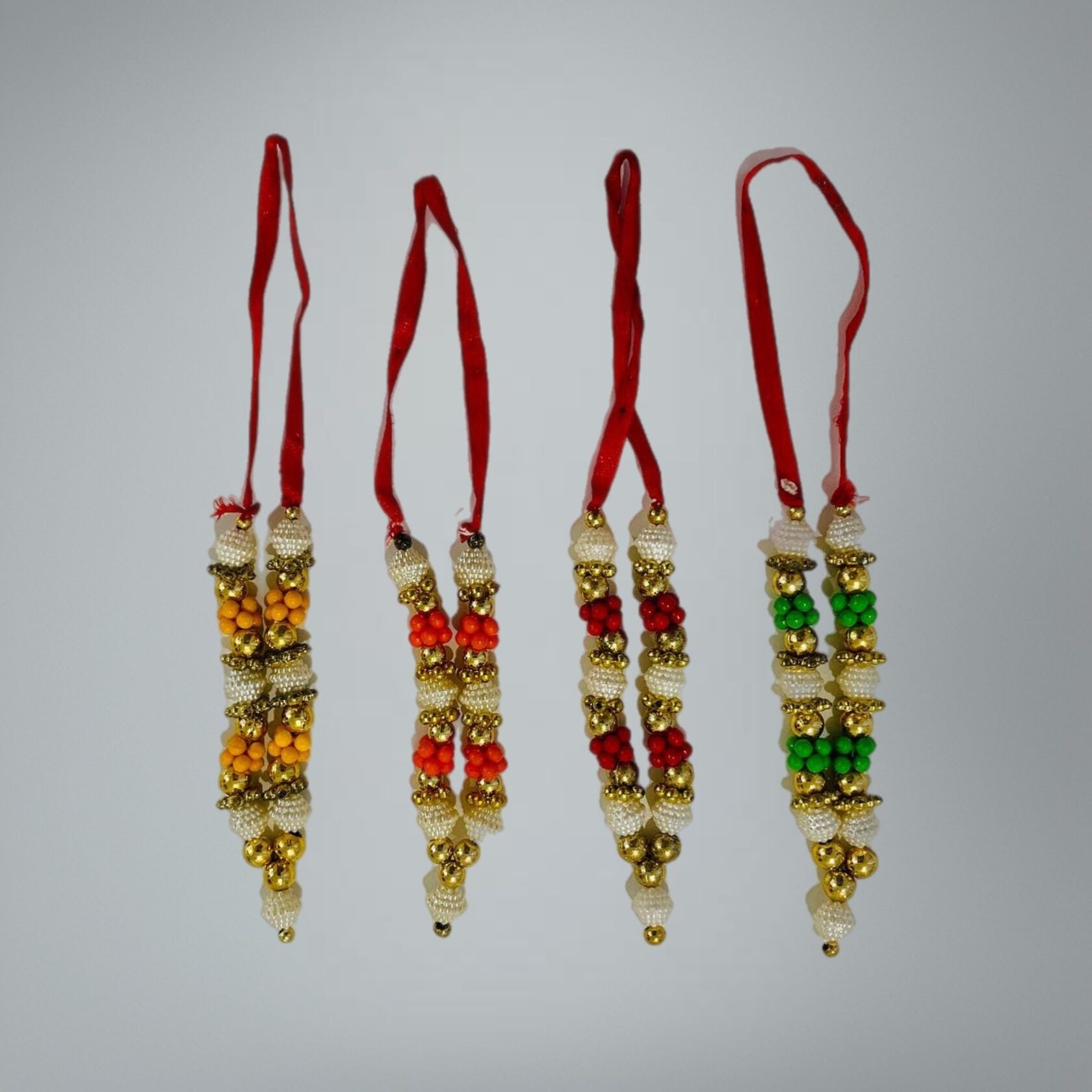 Deity garland draped on altar murti in devotional setting - Bhakti Shop